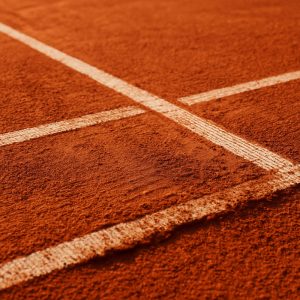 Superficie de cancha de tenis de arcilla roja