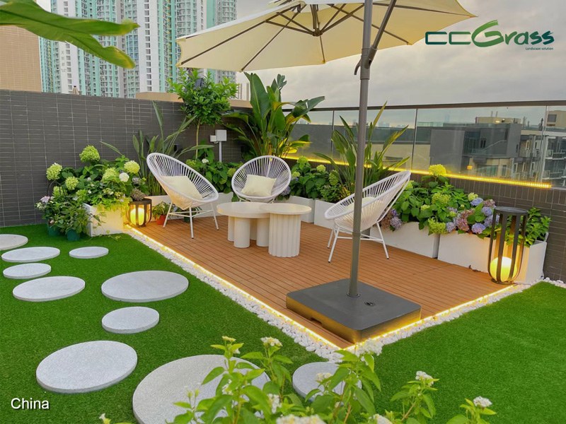 Rooftop terrace garden with artificial grass creating a comfortable outdoor living space Rooftop terrace garden with artificial grass creating a comfortable outdoor living space